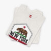 Folded view of a New York State of Confusion t-shirt in Heather Cement